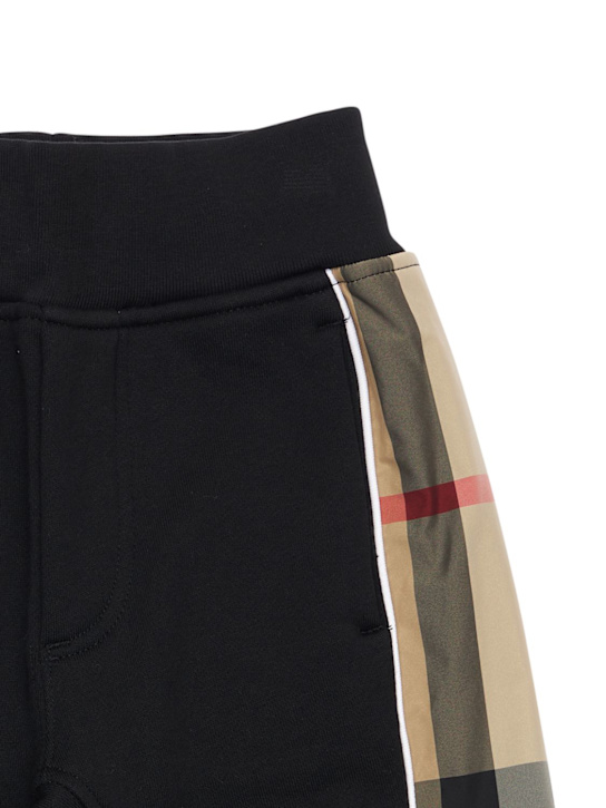 Burberry: Cotton sweatpants w/ check inserts - Black - kids-boys_1 | Luisa Via Roma