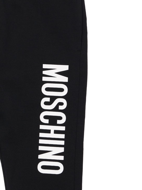 Moschino: Pantalon de jogging en coton imprimé logo - Noir - kids-girls_1 | Luisa Via Roma