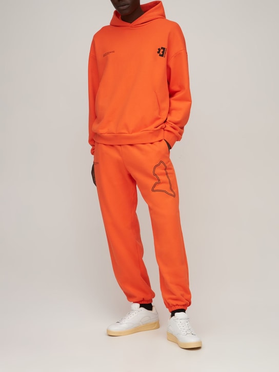 Pangaia: Sweat à capuche en coton Pangaia X Extreme E - Orange - men_1 | Luisa Via Roma