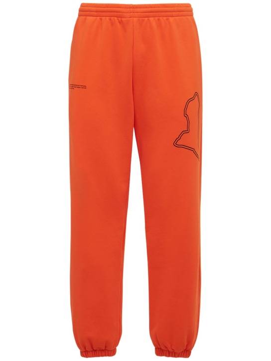 Pangaia: Pangaia X Extreme E cotton track pants - Orange - men_0 | Luisa Via Roma