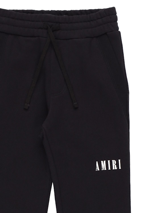Amiri: Logo print cotton sweatpants - Black - kids-boys_1 | Luisa Via Roma