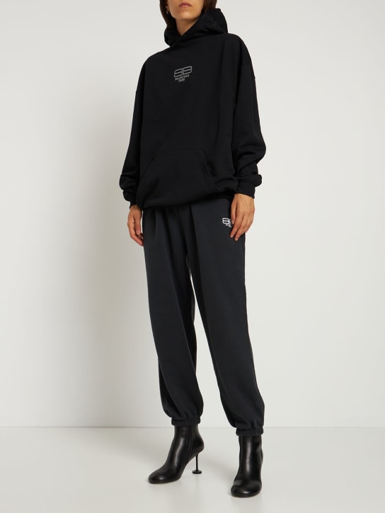 Balenciaga: Pantalones de felpa de algodón - Negro Lavado - women_1 | Luisa Via Roma