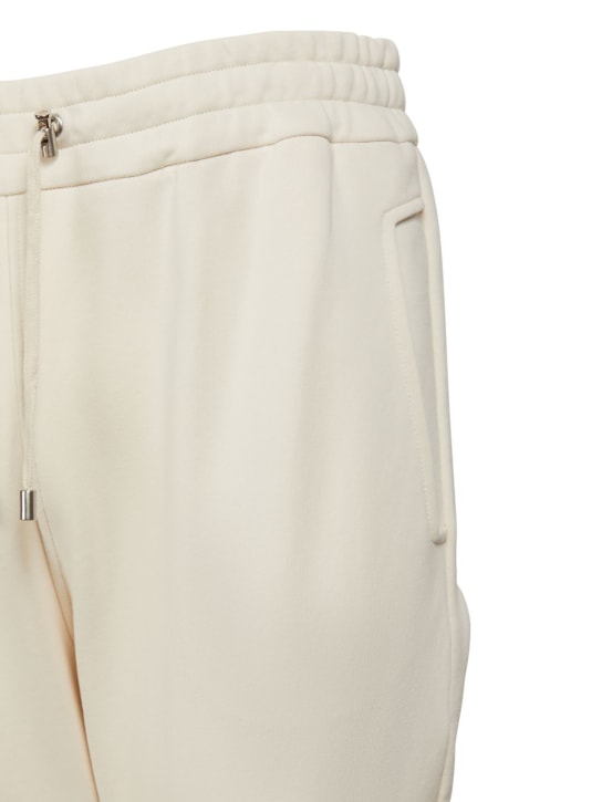 Balmain: Pantalon en jersey de coton floqué - men_1 | Luisa Via Roma