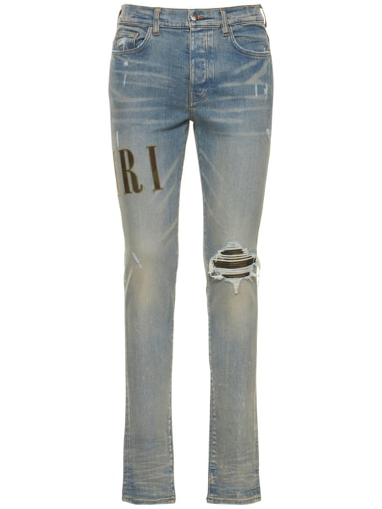 Amiri: Jeans in denim con logo applicato - men_0 | Luisa Via Roma