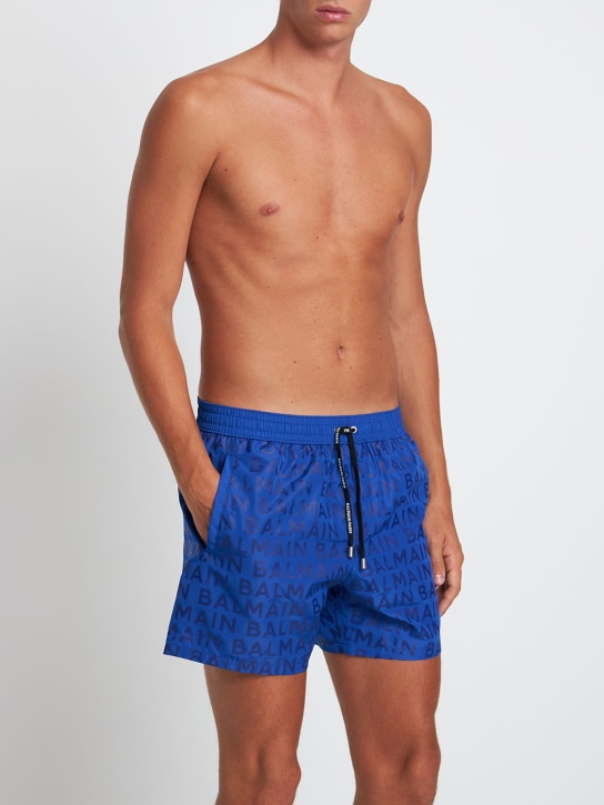 Balmain: Logo printed nylon swim shorts - men_1 | Luisa Via Roma