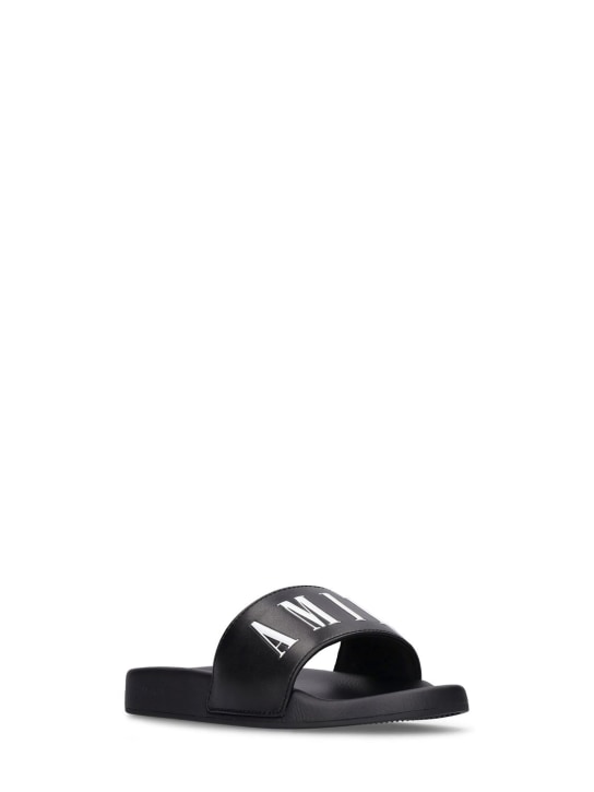 Amiri: Logo print rubber slide sandals - Black - kids-boys_1 | Luisa Via Roma