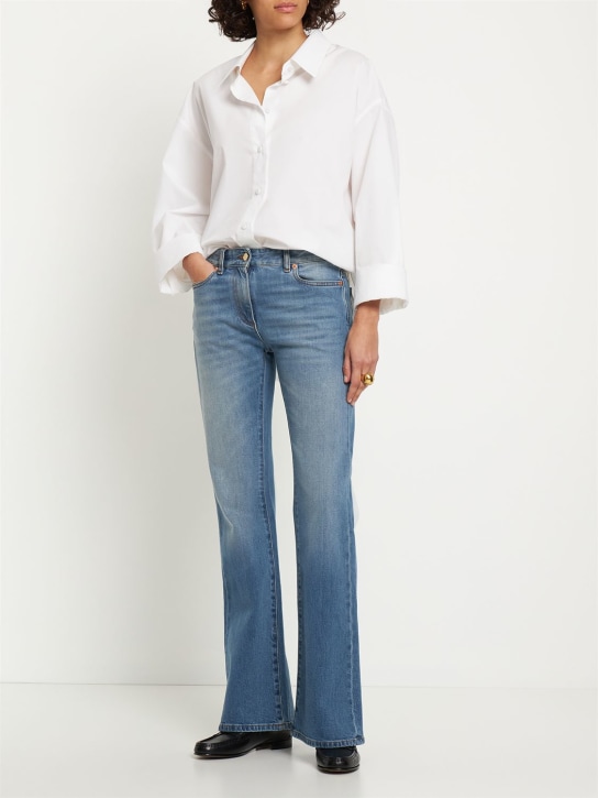 Valentino: Chain logo flared denim jeans - Blue - women_1 | Luisa Via Roma