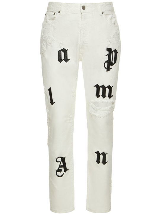 Palm Angels: Jeans con patch logo - Bianco - men_0 | Luisa Via Roma