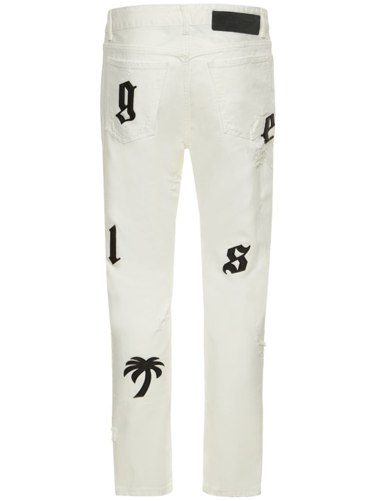 Palm Angels: Bull logo patch jeans - White - men_1 | Luisa Via Roma