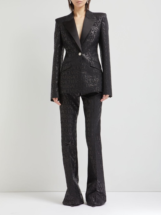 Versace: Jacquard logo flared pants - Black - women_1 | Luisa Via Roma
