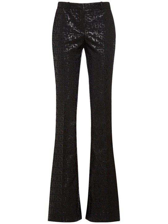 Versace: Jacquard logo flared pants - Black - women_0 | Luisa Via Roma