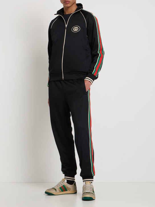 Gucci: Pantalones deportivos de techno y algodón - Negro - men_1 | Luisa Via Roma