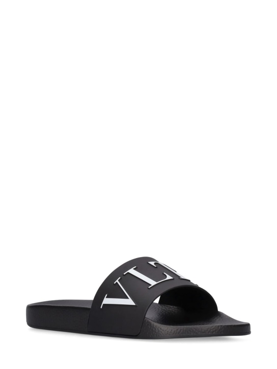 Valentino Garavani: VLTN logo slide sandals - Black/White - men_1 | Luisa Via Roma