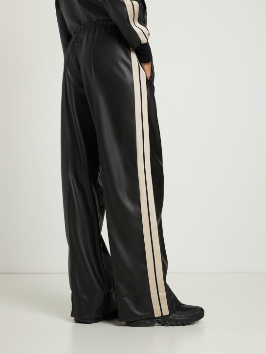 Palm Angels: Leather effect loose track pants - Black/Multi - women_1 | Luisa Via Roma