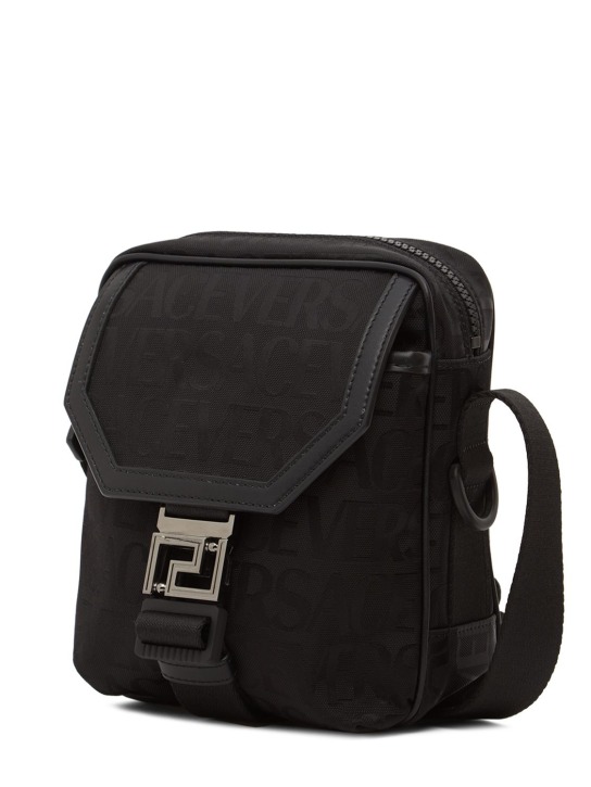 Versace: Logo jacquard nylon messenger bag - Black - men_1 | Luisa Via Roma