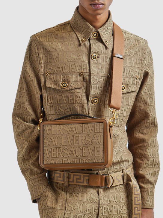 Versace: Logo fabric & leather crossbody bag - Bej/Kahverengi - men_1 | Luisa Via Roma