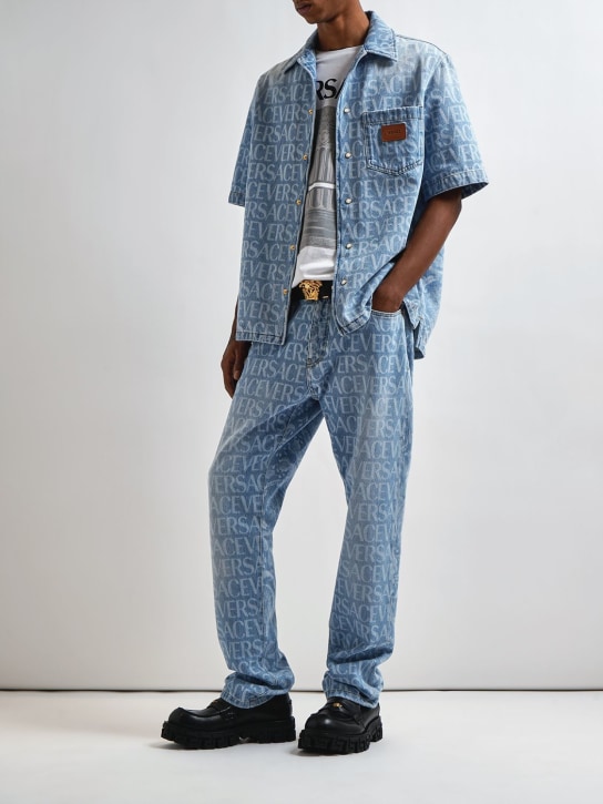 Versace: Monogram cotton denim jeans - Açık Mavi - men_1 | Luisa Via Roma