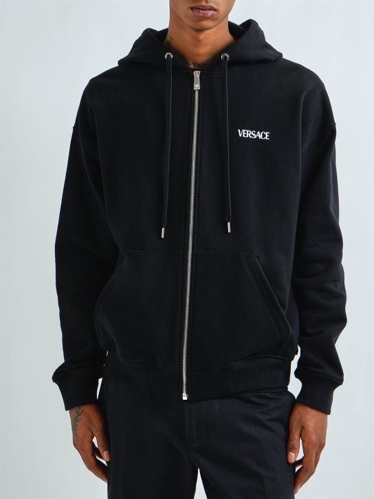 Versace: Logo printed cotton zip hoodie - Black - men_1 | Luisa Via Roma