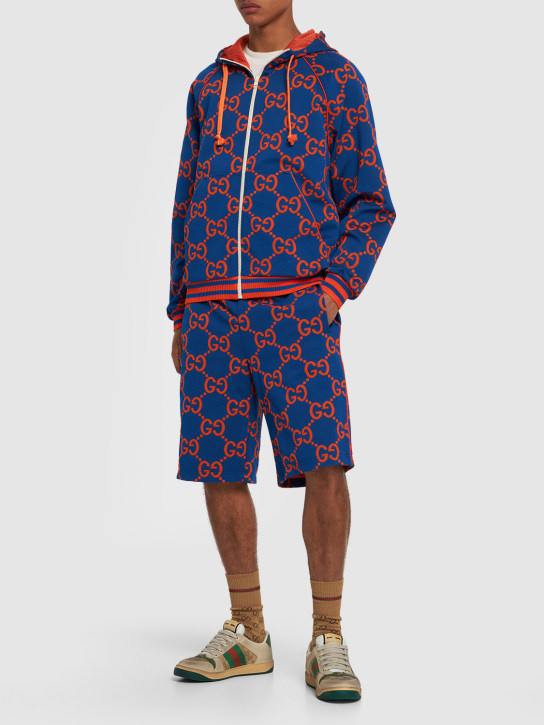 Gucci: Shorts in techno felpa GG jacquard - Blu/Arancione - men_1 | Luisa Via Roma
