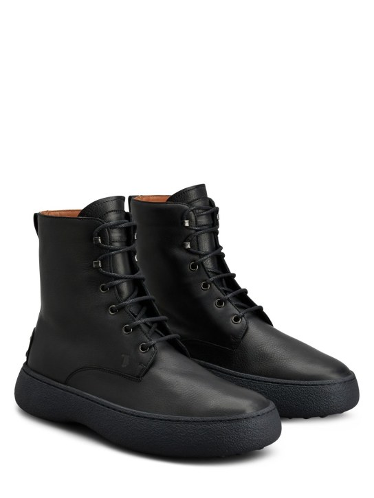Tod's: Leather lace-up boots - Negro - men_1 | Luisa Via Roma