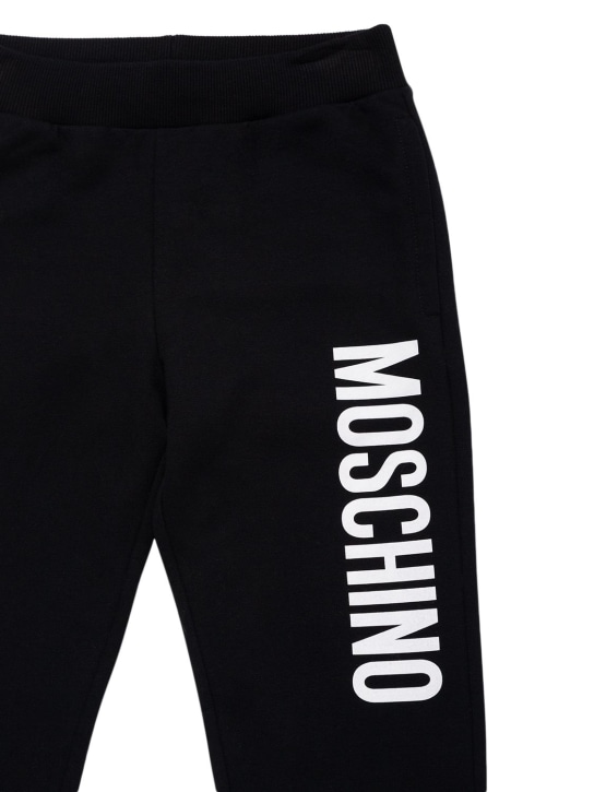 Moschino: Pantalon en coton à logo caoutchouté - kids-boys_1 | Luisa Via Roma