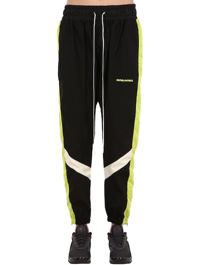 track pants black and yellow