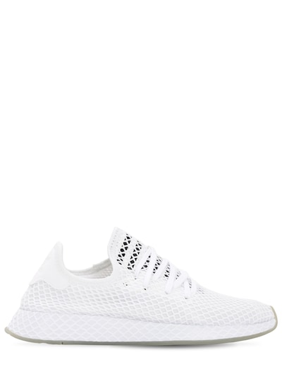 white netted adidas trainers