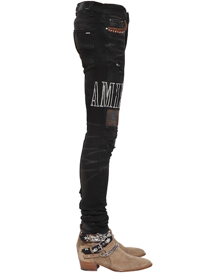 amiri black patch jeans