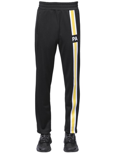 yellow track pants with black stripe