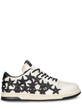 Amiri: Sneakers de piel con estrellas - Blanco/Negro - men_0 | Luisa Via Roma