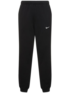 Nike: Pantalones Nocta Fleece - Negro/Blanco - men_0 | Luisa Via Roma