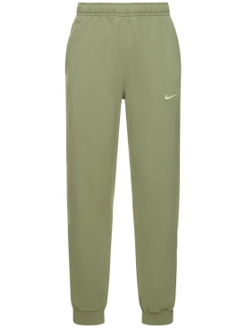 Nike: Pantaloni Nocta in pile - Oli Green/Lime - men_0 | Luisa Via Roma