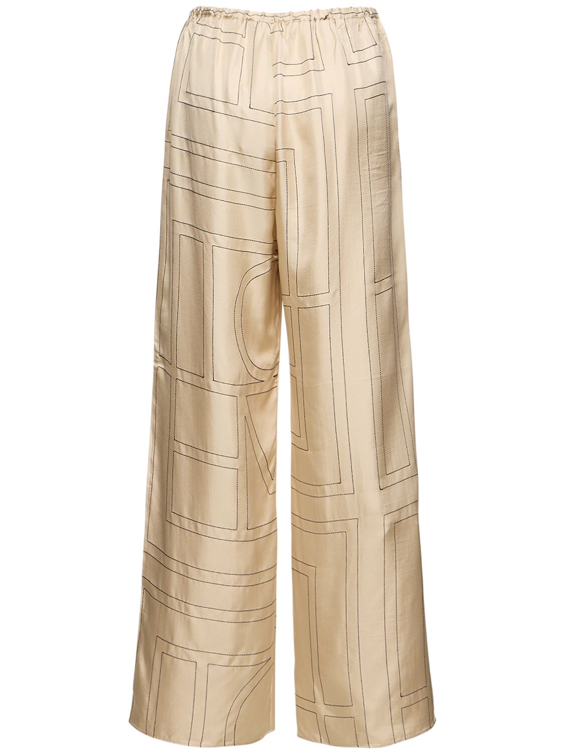 Shop Totême Monogram Embroidered Silk Pants In White