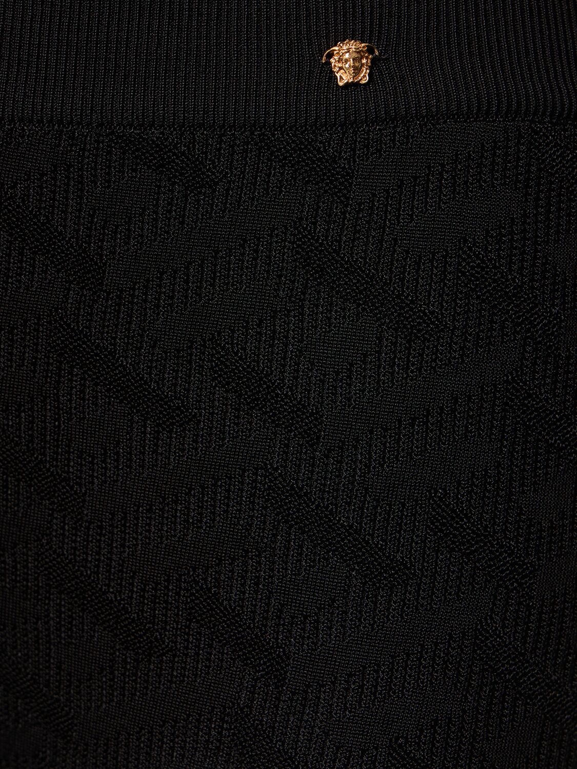 Shop Versace Logo Jacquard Knit Viscose Flared Pants In Black