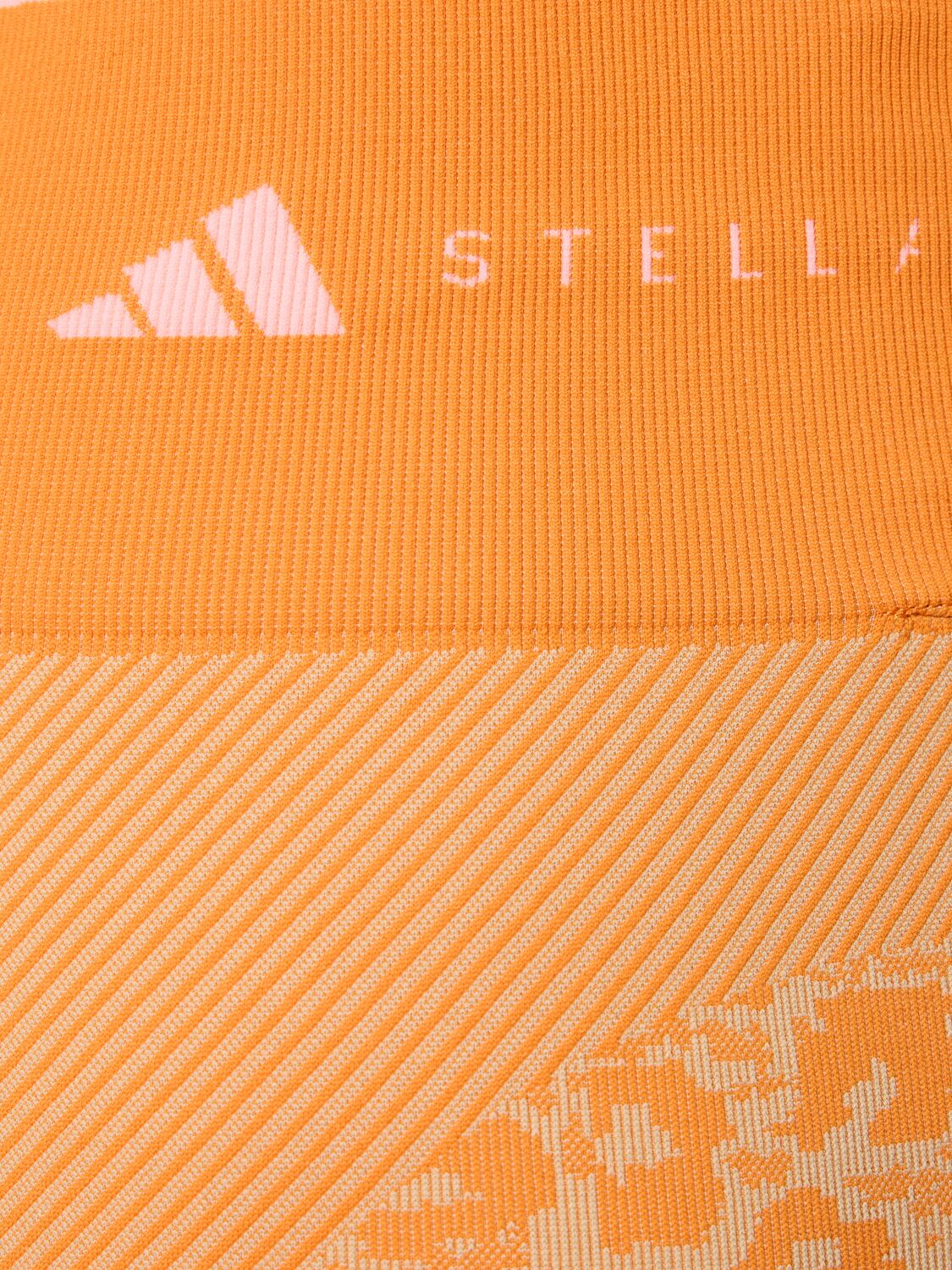 Shop Adidas By Stella Mccartney True Strength Recycled Tech Bike Shorts In Orange