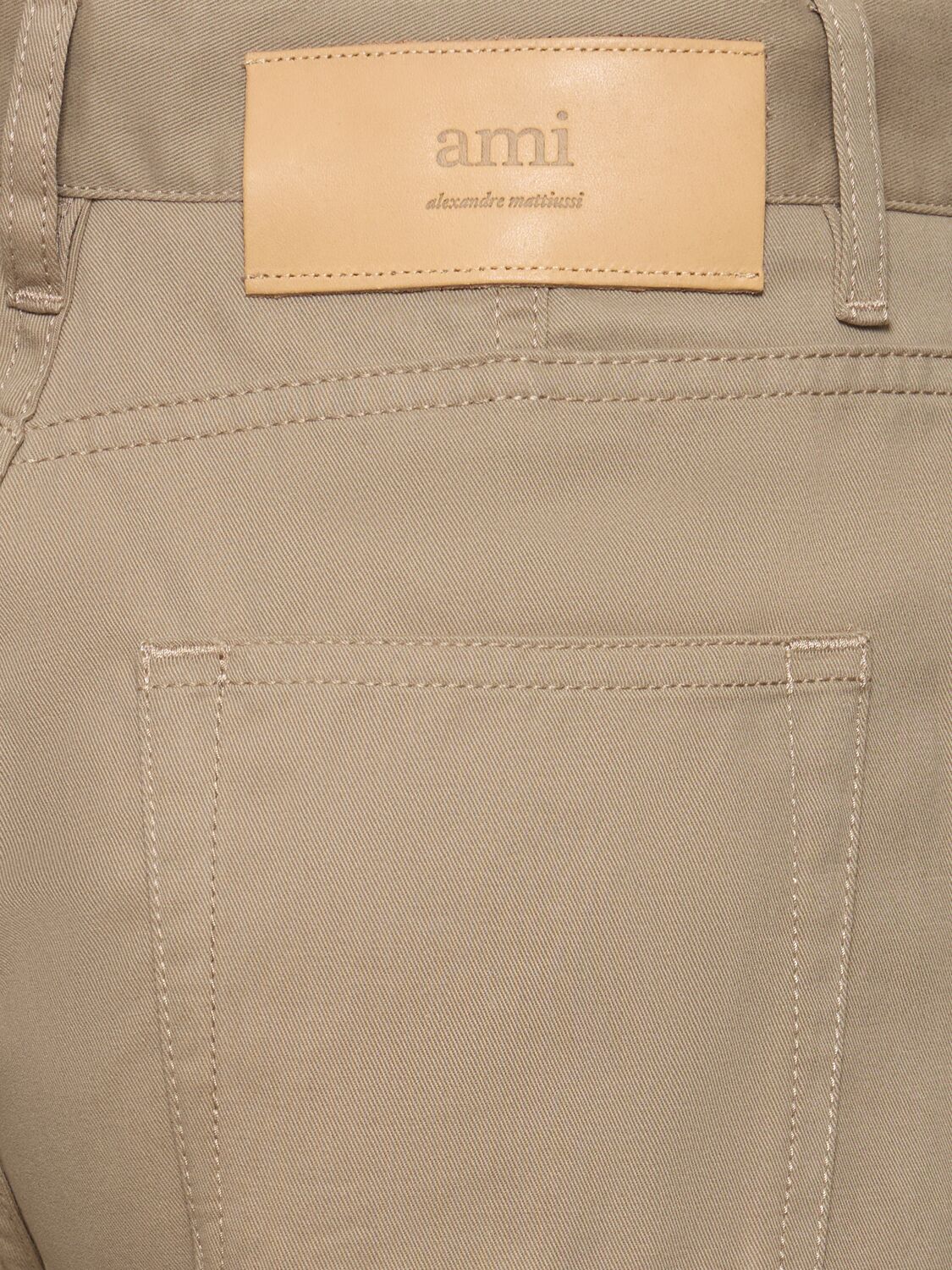 Shop Ami Alexandre Mattiussi High Rise Flared Cotton Denim Jeans In Beige