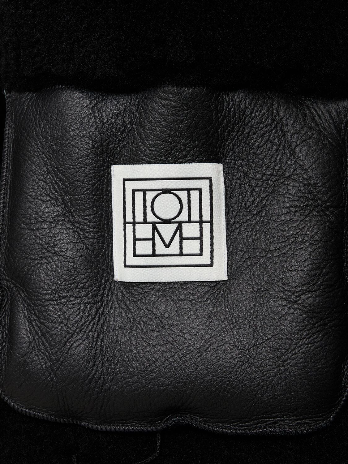 Shop Totême Signature Shearling Zip Coat In Black