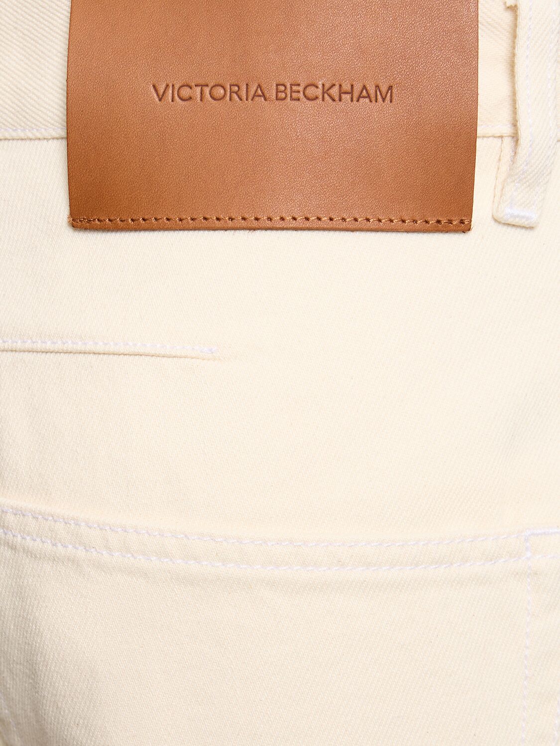 Shop Victoria Beckham Twisted Low-rise Slouch Denim Jeans In White
