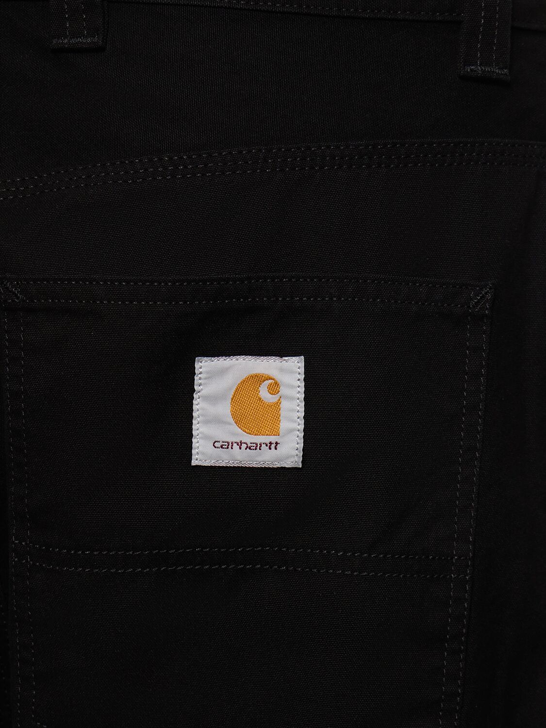 Shop Carhartt Wide Panel Rinsed Pants In Rinsed Black