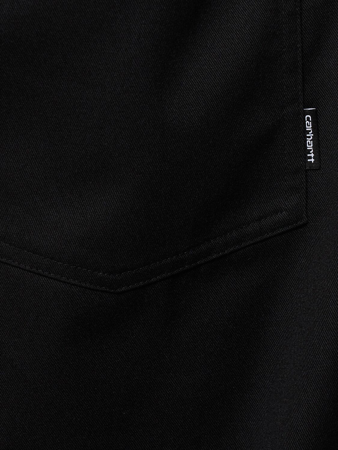 Shop Carhartt Newhaven Rinsed Canvas Pants In Rinsed Black