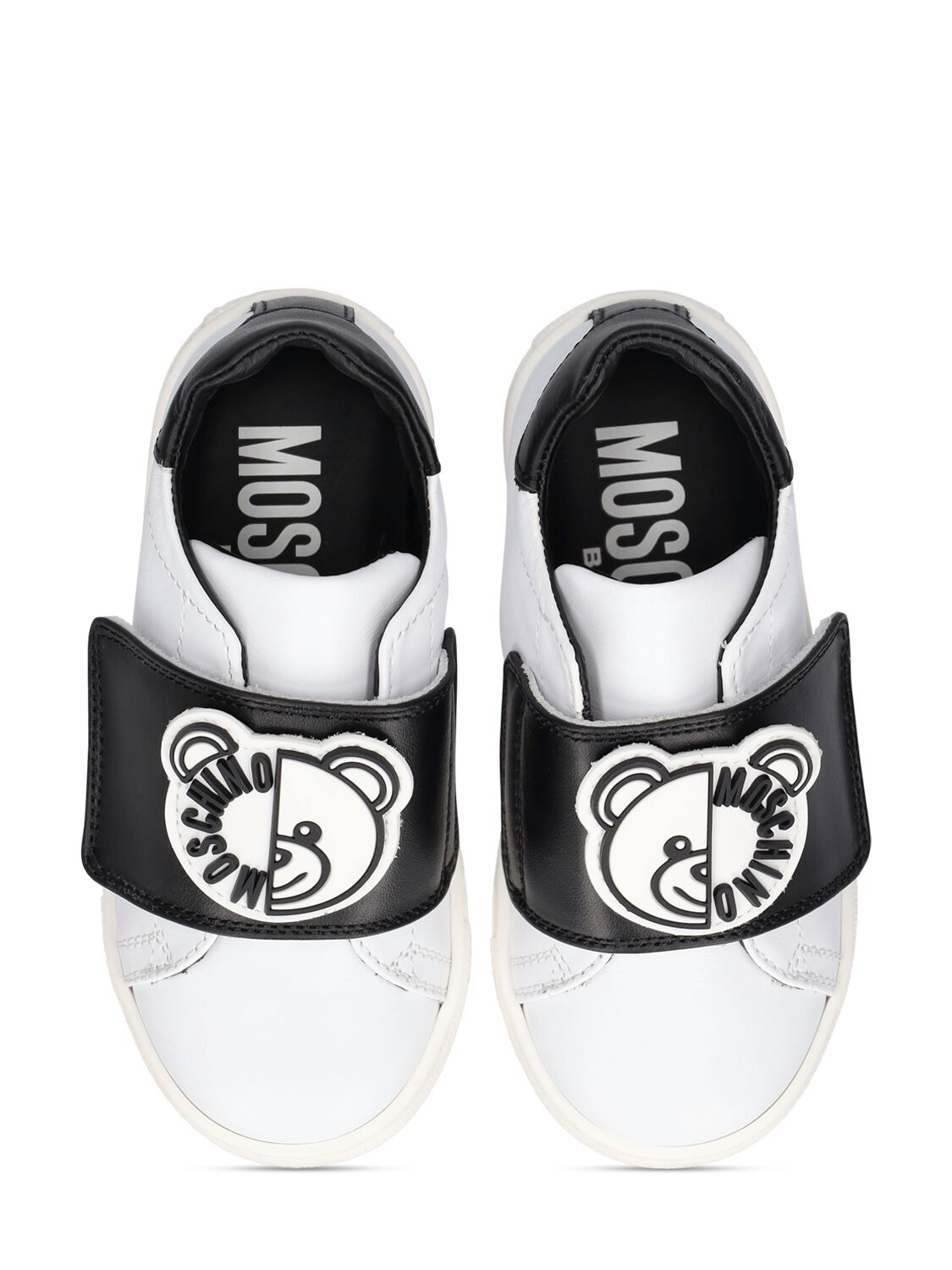 Shop Moschino Leather Strap Sneakers W/ Patches In White,black