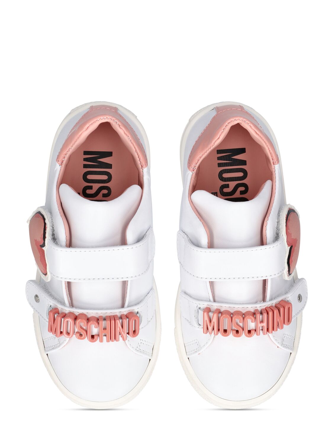 Shop Moschino Logo Leather Strap Sneakers In White,pink