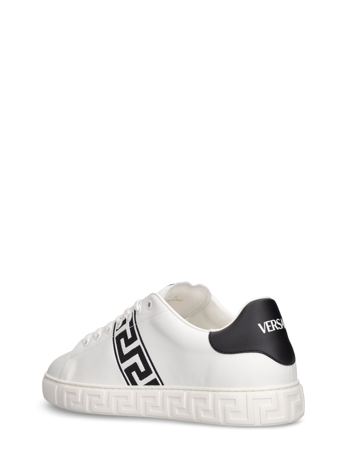 Shop Versace Faux Leather Logo Sneakers In White,black