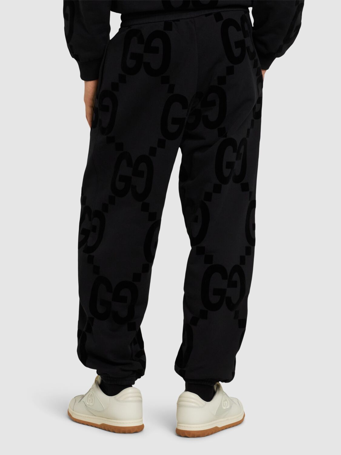 Shop Gucci Gg Flocked Cotton Sweatpants In Black