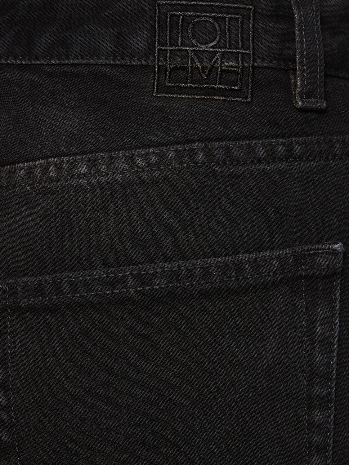 Shop Totême Flared High Rise Denim Jeans In Black