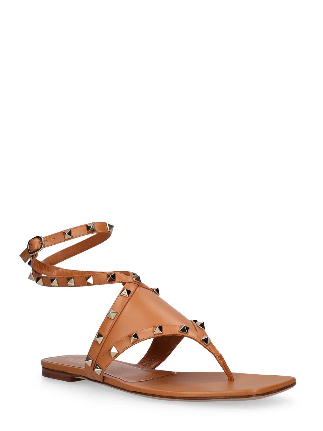 Shop Valentino Rockstud Leather Thong Sandals In Tan