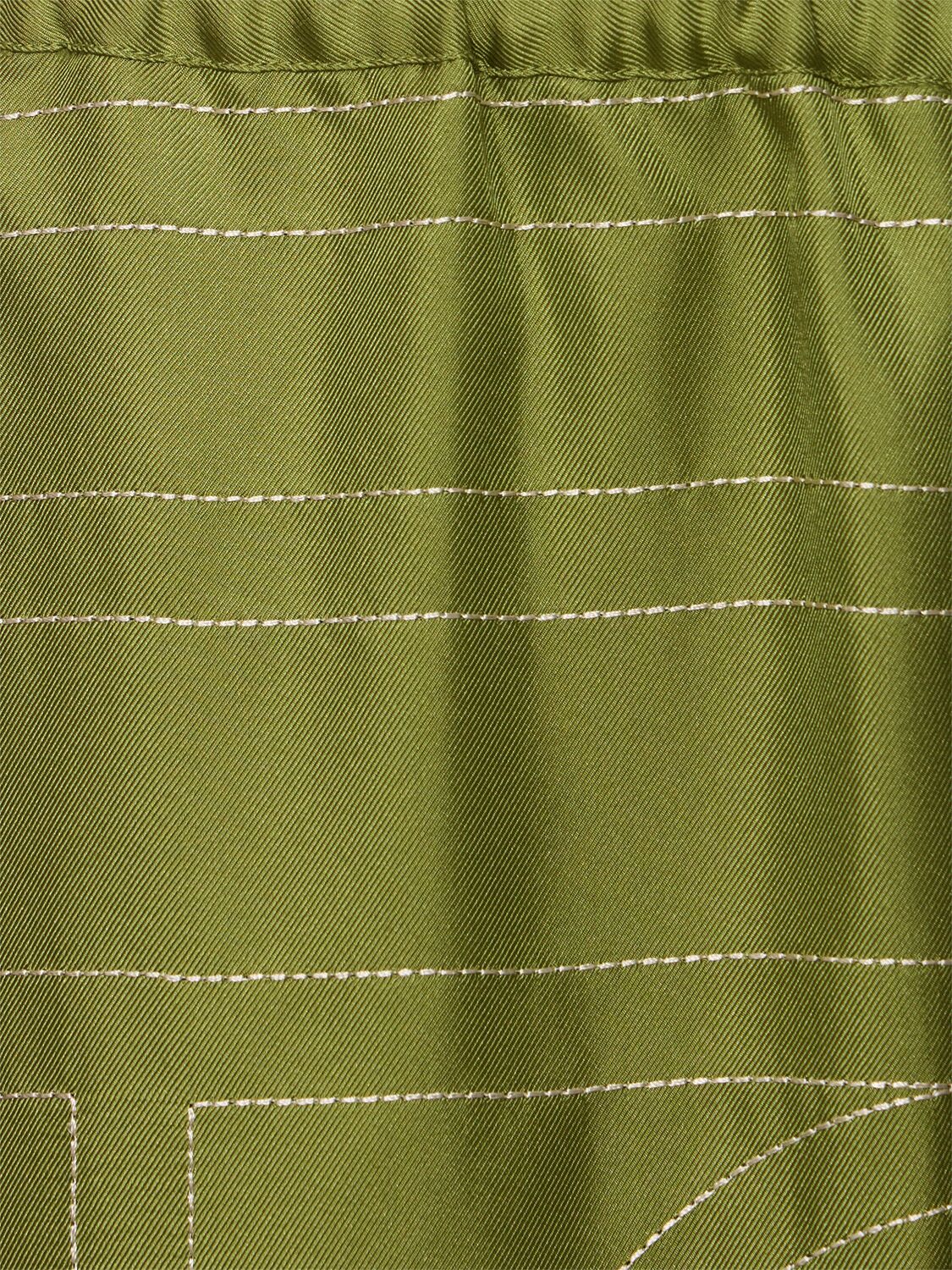 Shop Totême Monogram Silk Pajama Pants In Green