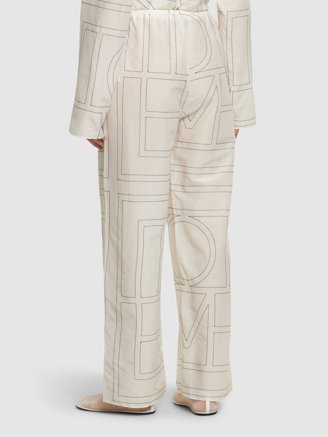 Shop Totême Monogram Cotton Blend Pajama Pants In White/black