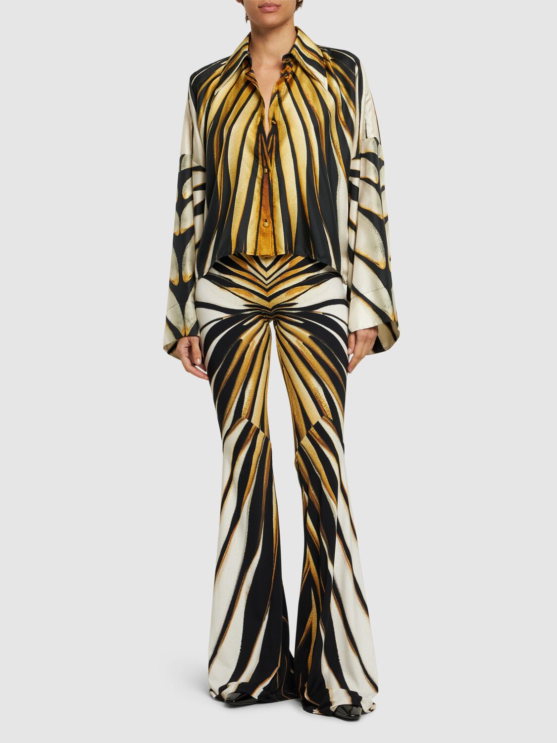 Shop Roberto Cavalli Ray Of Gold Printed Lycra Flared Pants In Yellow/black