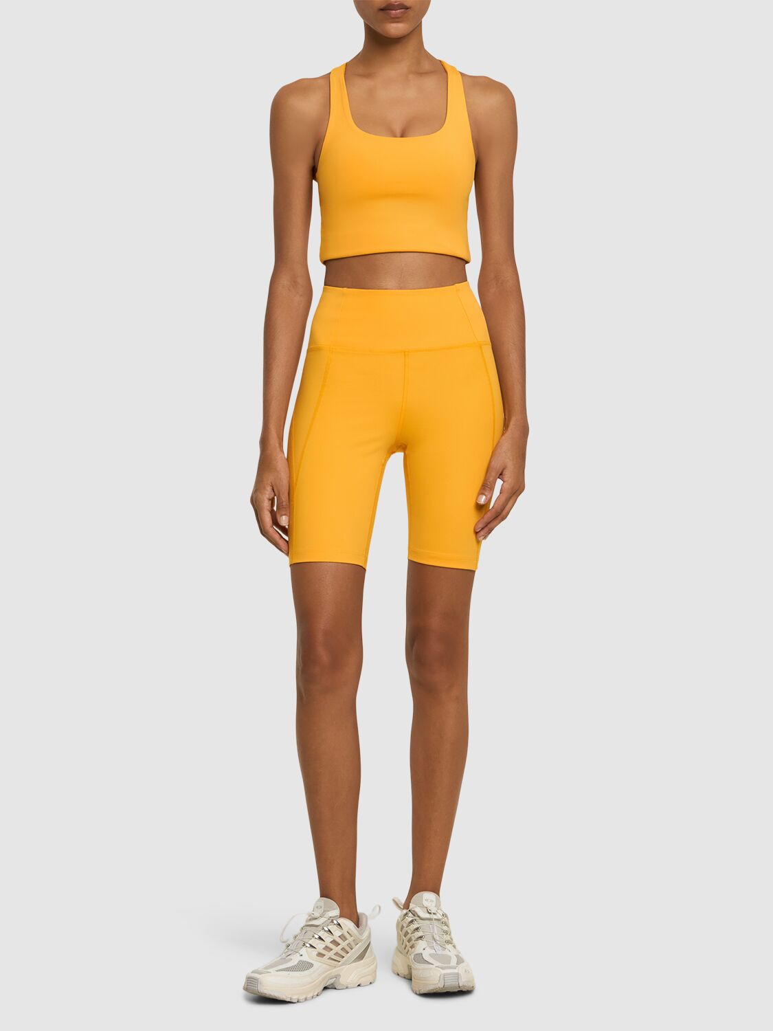 Shop Girlfriend Collective High Rise Stretch Tech Running Shorts In Yellow